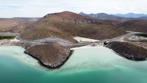 Aerial-view-over-the-gorgeous-coastline-overlooking-the-pristine-beach-and-turquoise-sea-in-Playa-El-Tecolote-Baja-California-Sur-Mexico-during-a-great-trip