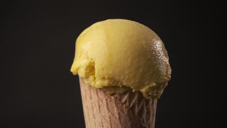 360 degrees rotation of a delicious mango ice cream cone. sweet and dessert concept.