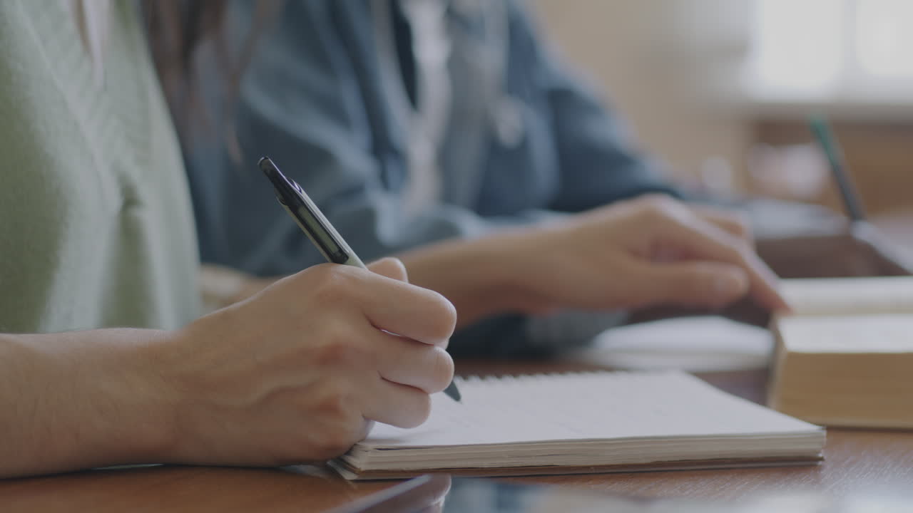 Students taking notes in a classroom