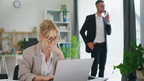 concentrated office worker on laptop