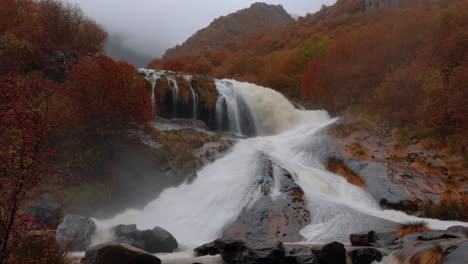 majestic waterfall in autumn forest landscape