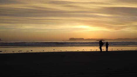 sunset at a beach near tofino on vancouver island - canada