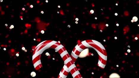 animation of spots of lights and christmas candies on black background