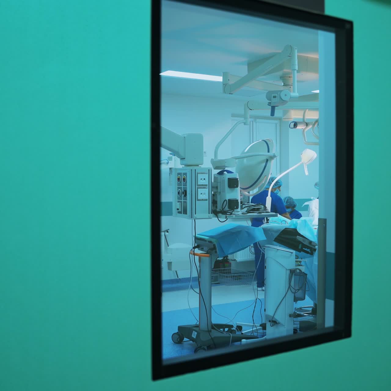 In surgery. Medical team performing operation in hospital operating theater. Working with surgical instruments.