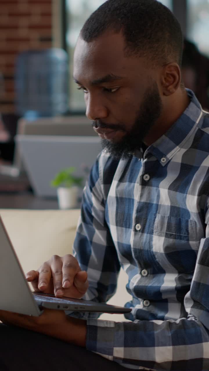 Man working on laptop in office