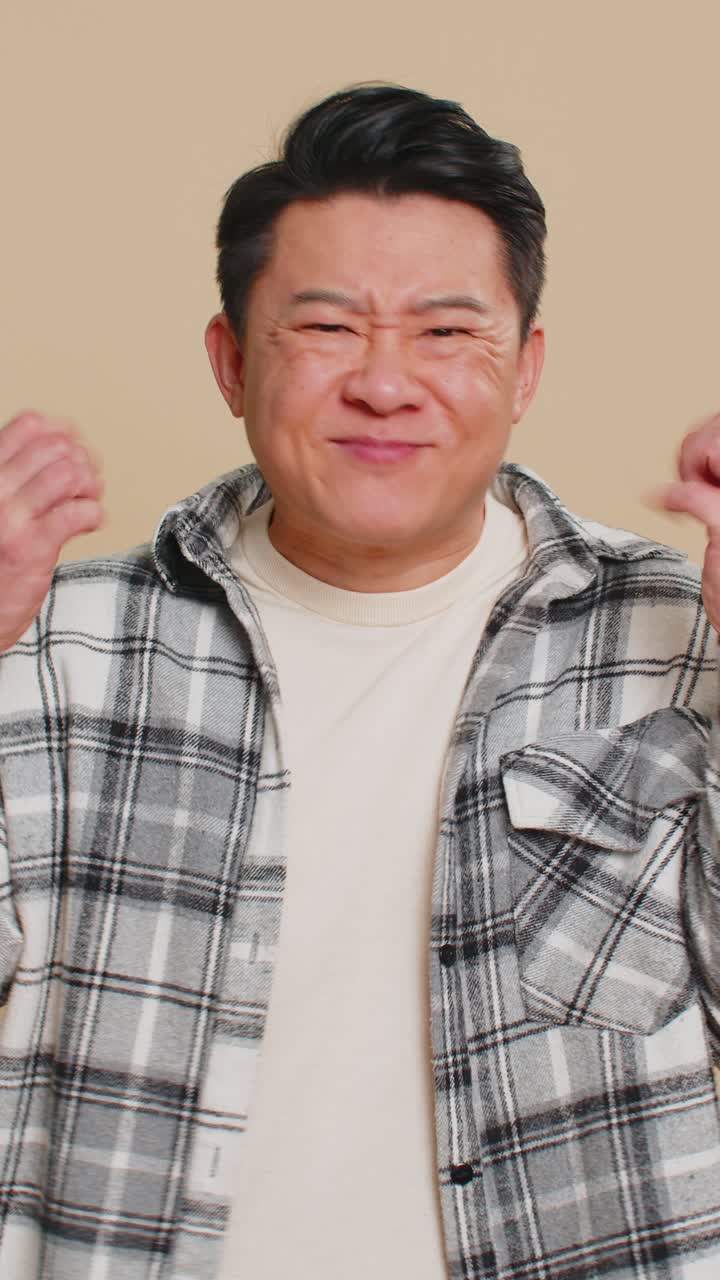 Upset frustrated annoyed asian man in indignant expression quarreling asking reason of conflict