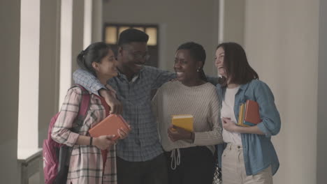 multicultural group of university students laughing