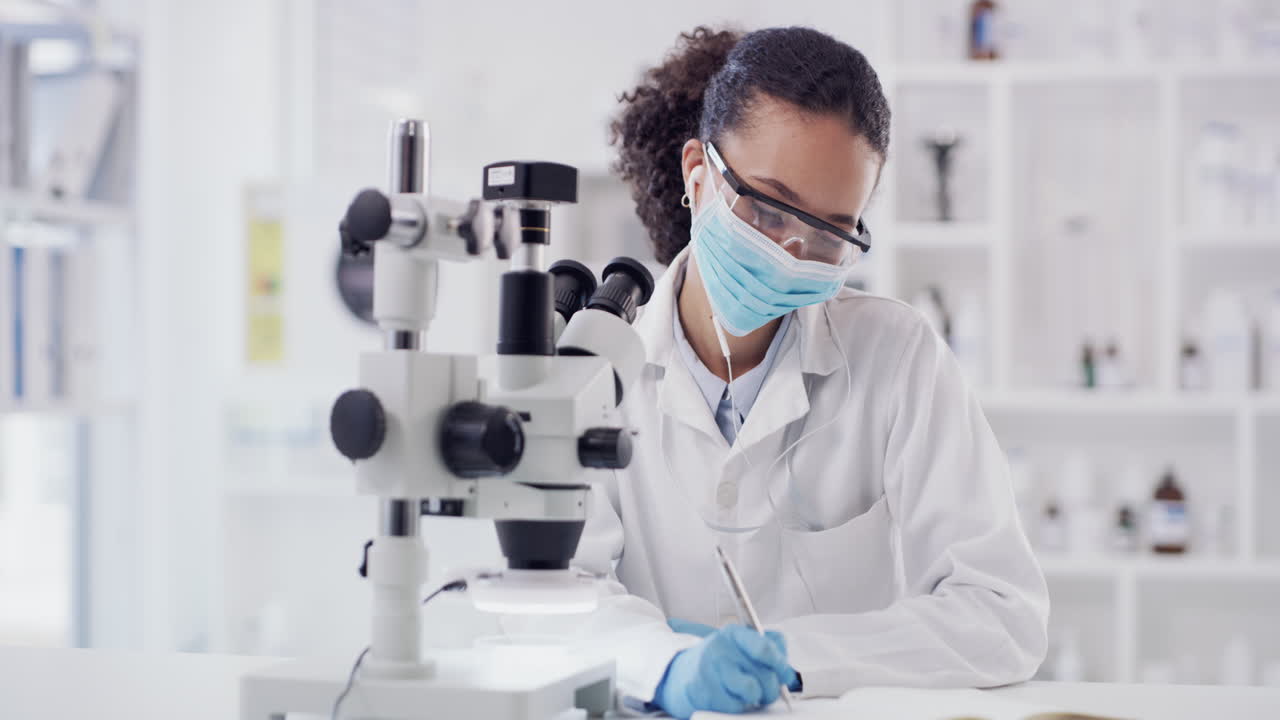 Scientist working, writing