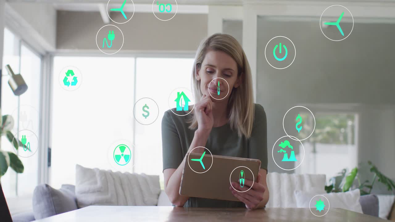 Video verticale: Donna che tocca il tablet, causando l'agglomerarsi di icone verdi, mentre esamina le opzioni energetiche.