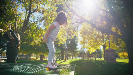 children playing in a park in autumn
