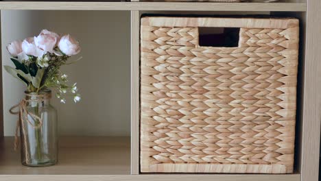 decorative shelf with flowers and basket