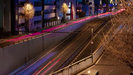 a night timelapse of the traffic jam at the city street in tokyo