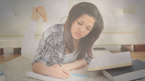 animation of bokeh over happy asian woman writing in notebook