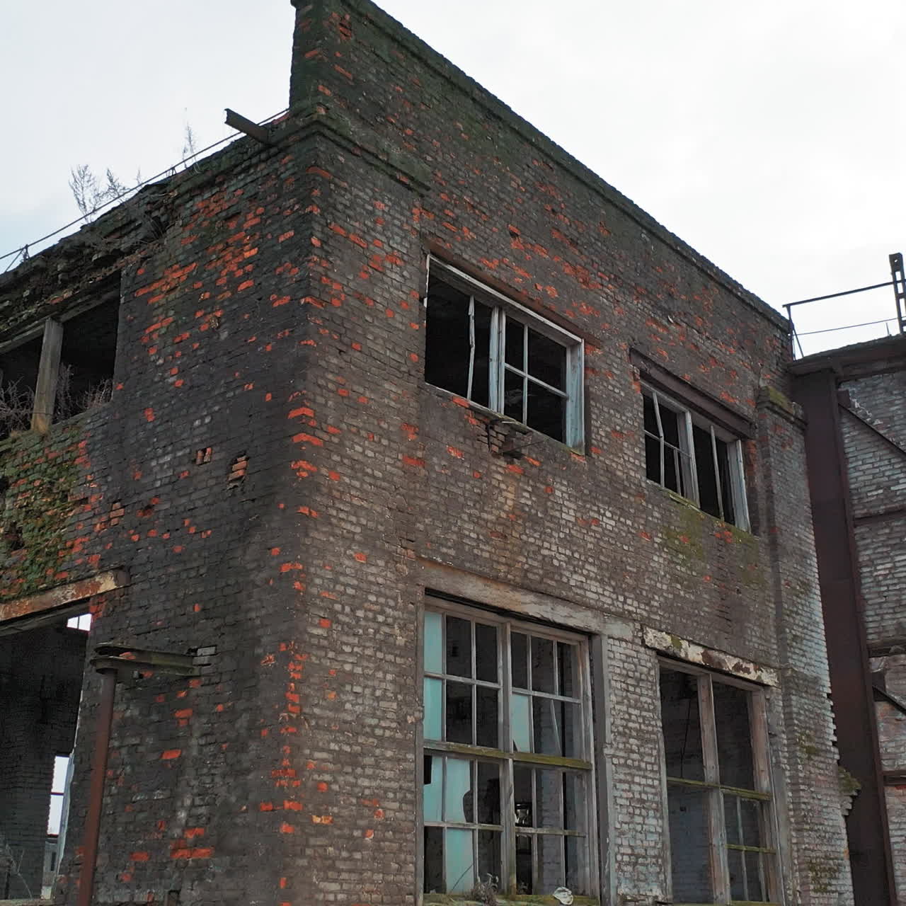 Flight over the destroyed factory. Old industrial building for demolition. Aerial view