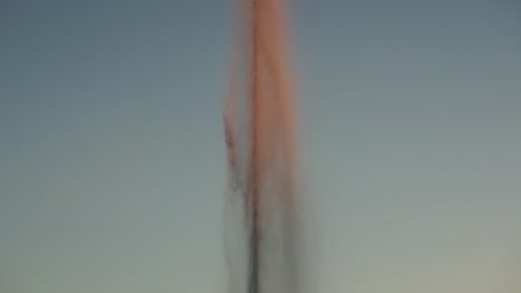 tilt reveal shot of fountain in pond in parque de las cruces, madrid, slow motion