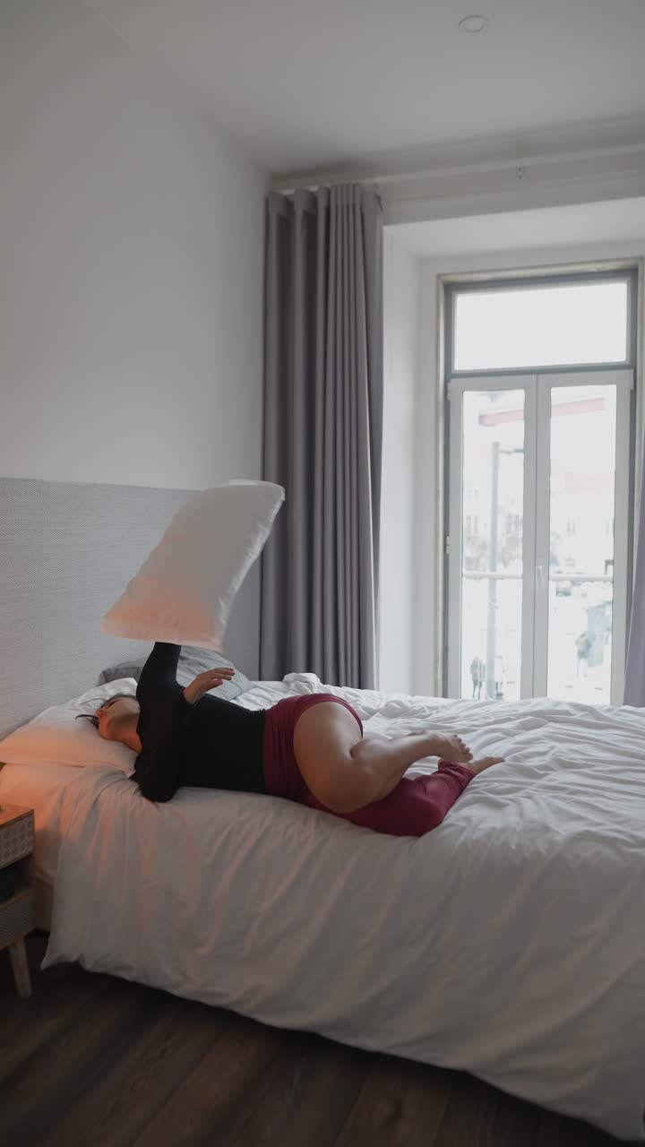 Woman Doing Yoga in Bedroom