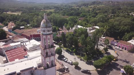 aerial of picturesque tower of parish of santa úrsula church in little town of cosala, tourist attraction in mexico