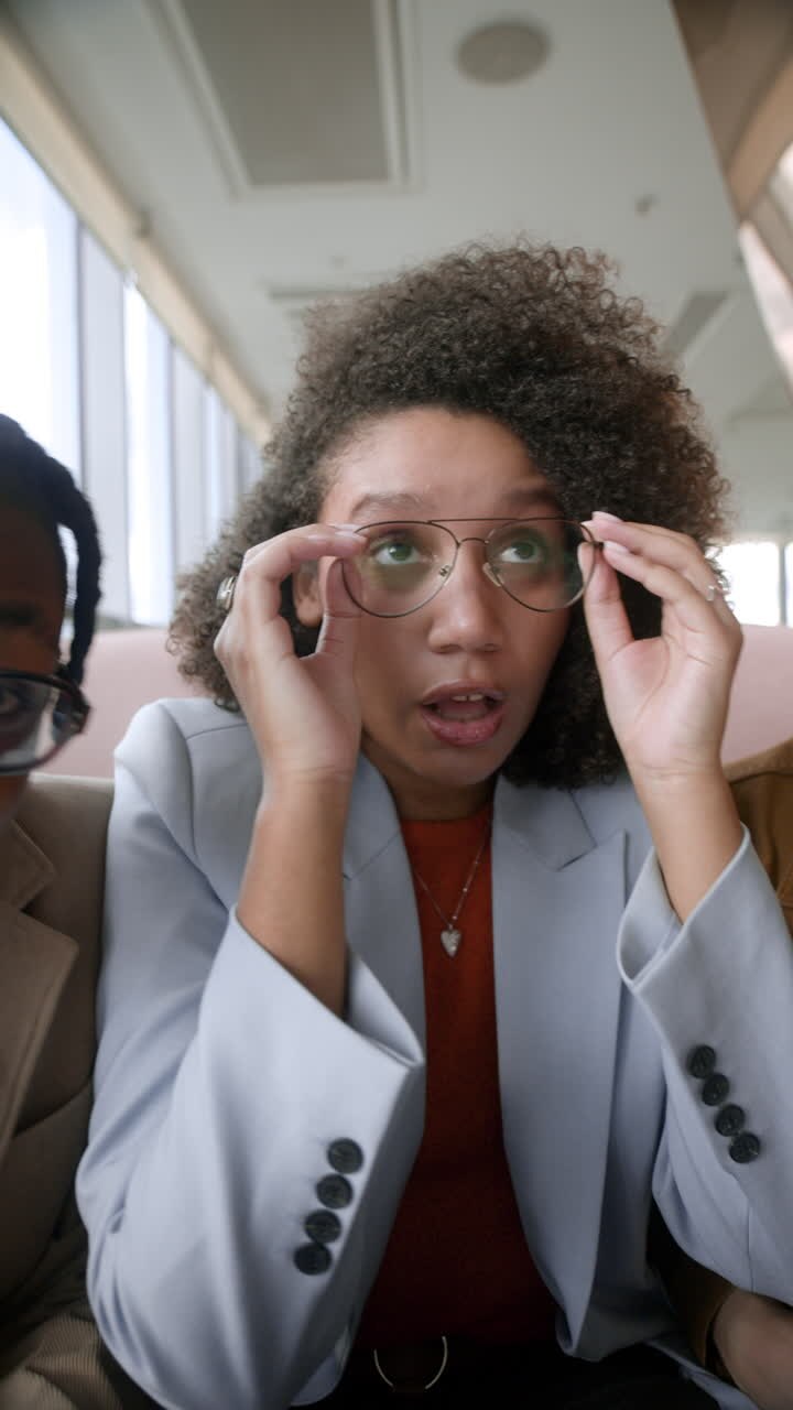 Woman in Business Attire During a Video Call