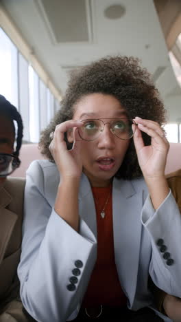 Woman in Business Attire During a Video Call