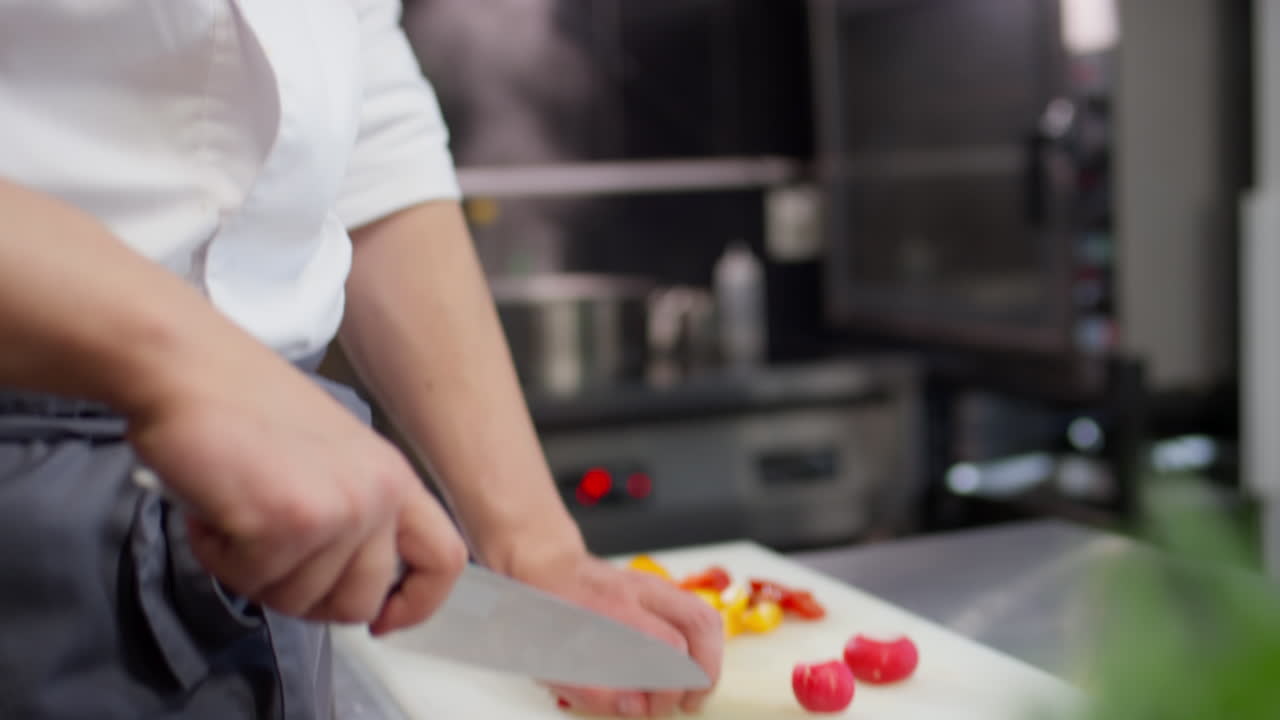 Chef Cutting Fresh Radishes in Restaurant Kitchen