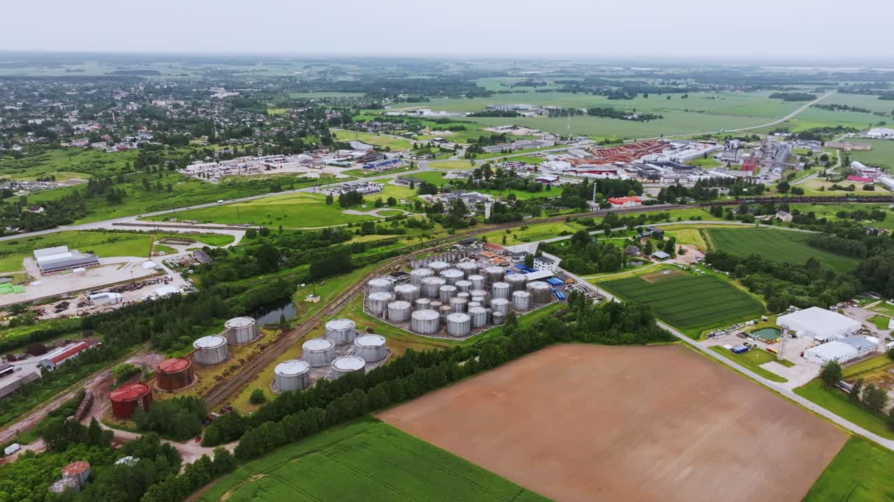 Cloudy aerial view shows Saldus industrial district blending with farmland