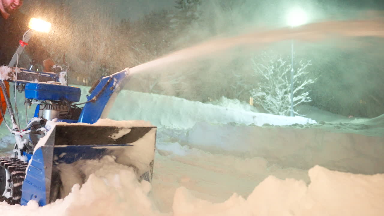 Working hard to clear area of heavy snowfall, maintenance duties