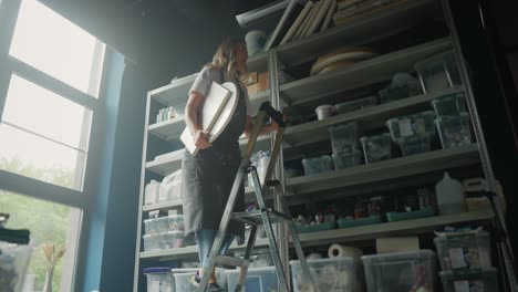 woman artist working in her art studio