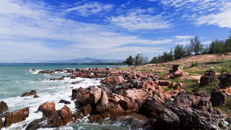 aerial view pan of the rocky coast in lam dong