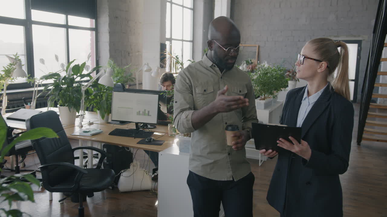 Business Colleagues Discussing in Modern Office