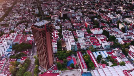 aerial flying over benito juarez near torre axa tower at mexico city