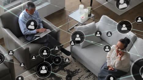 animation of network of connections with icons over diverse business people in office
