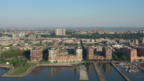 A-high-angle-view-over-the-Hudson-River-showing-Hoboken,-NJ-at-sunrise-with-a-colorful-sky