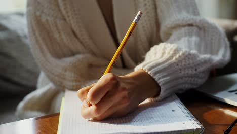 woman taking notes