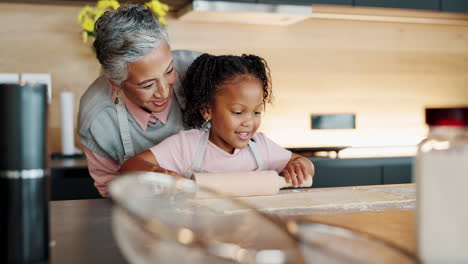 grandmother and granddaughter baking together