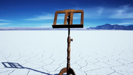 an-old-music-stand-is-on-white-salt-desert