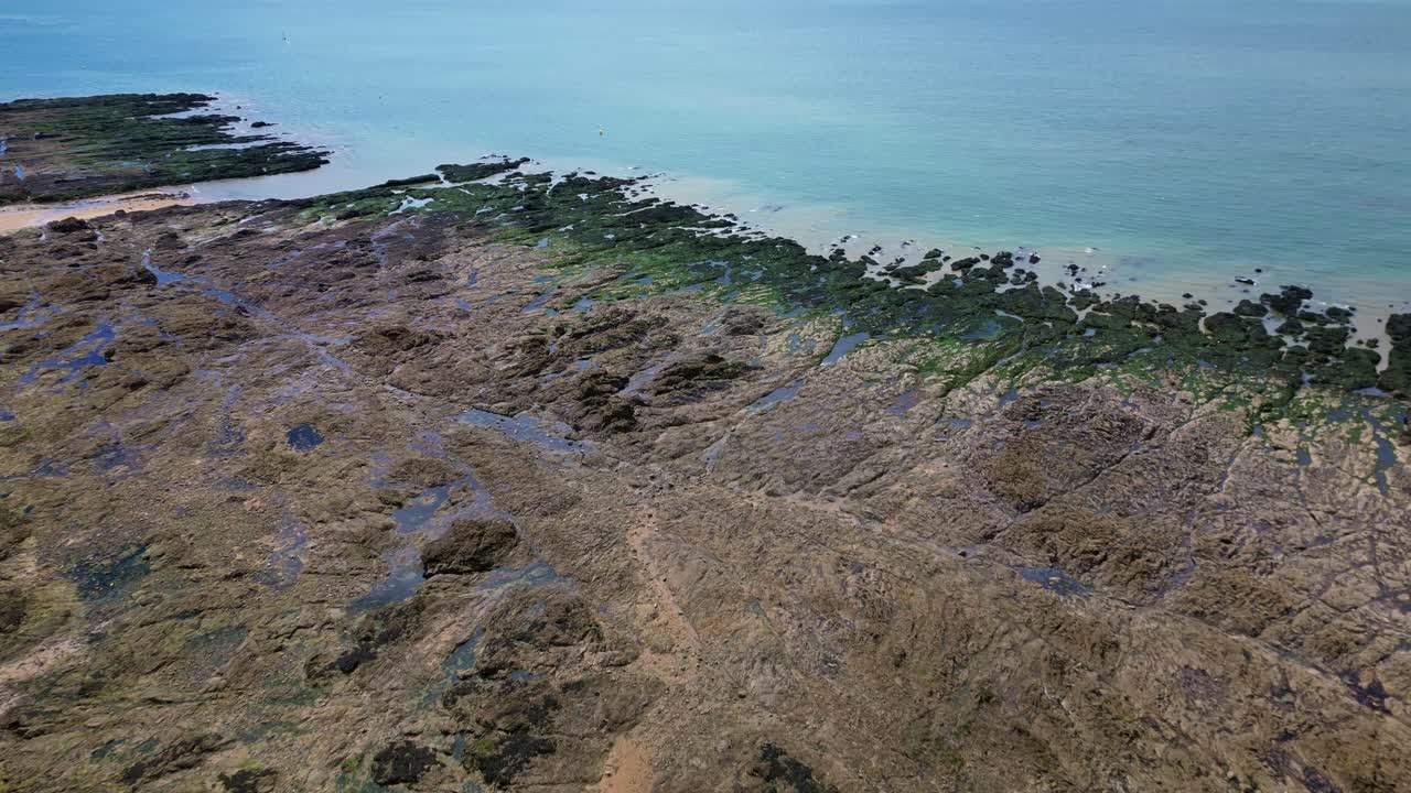 Aerial view of Plage de Bonne Source beach during low tide, Pornichet, France. Aerial forward descending