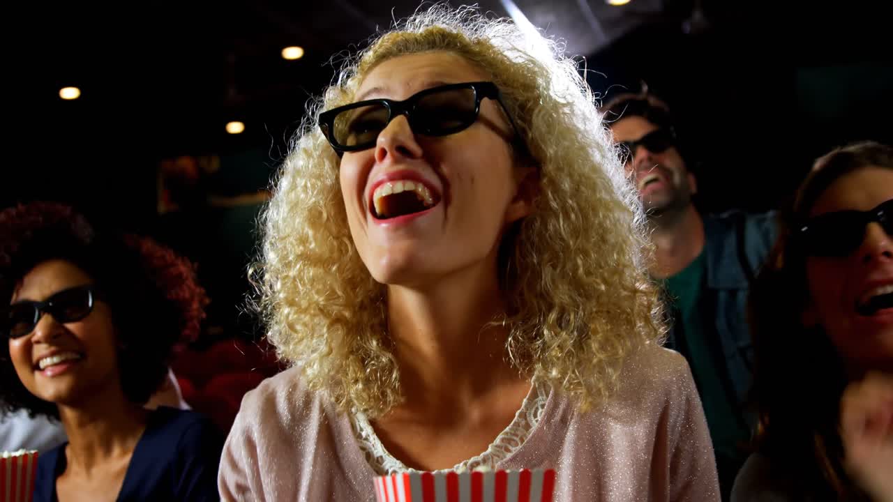 Group of people watching movie in theater 4k