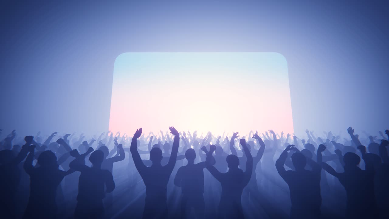 Silhouettes of a Cheering Crowd at a Concert with Glowing Screen