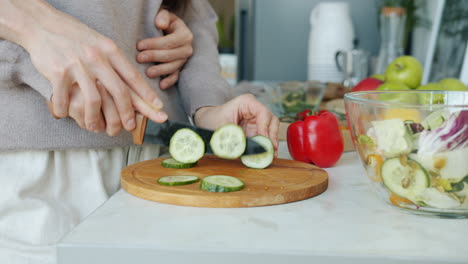 couple preparing a healthy salad together in the kitchen