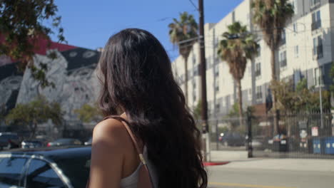 Asian-woman-walking-street-at-sunny-day.-Gorgeous-brunette-on-relaxing-stroll.