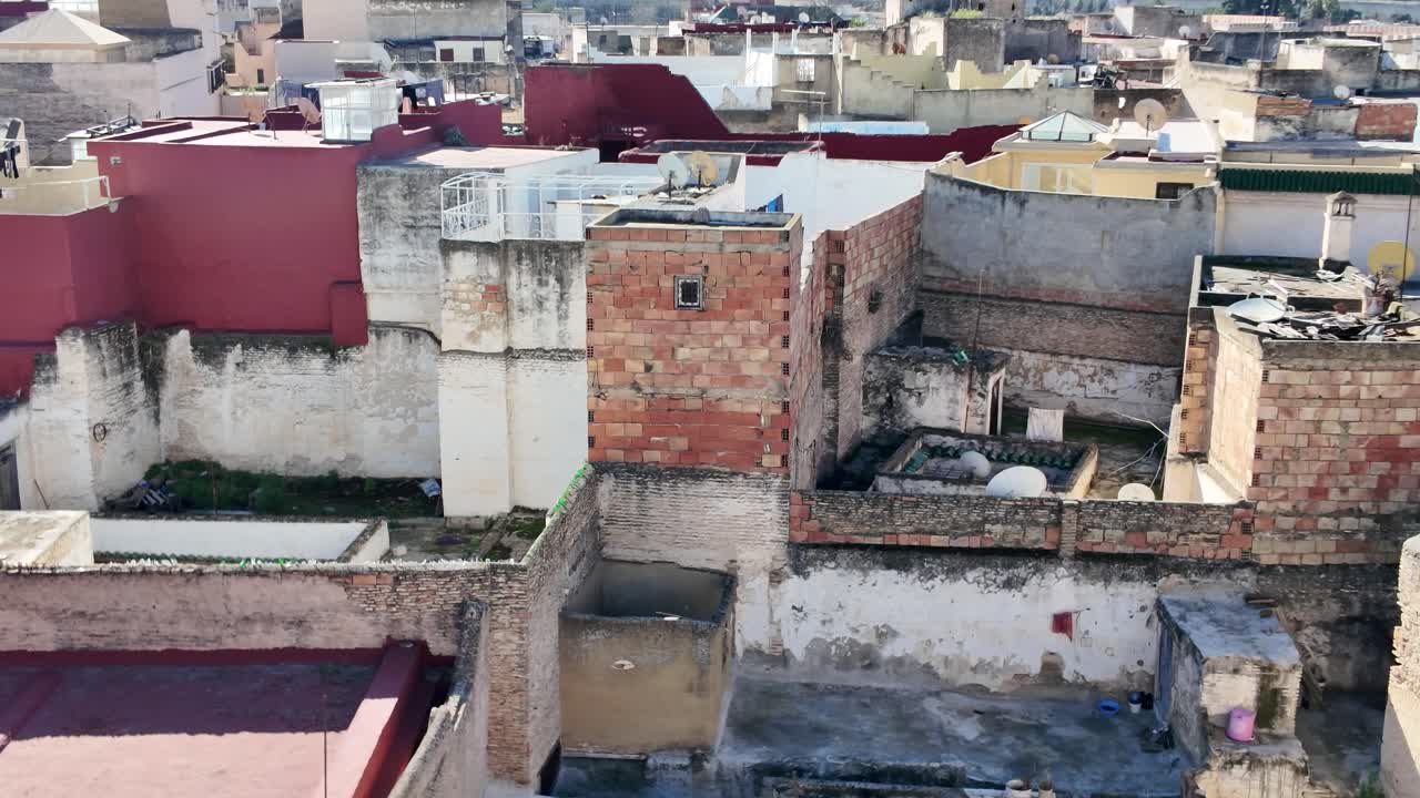 A view of Moroccan urban rooftops showcasing rustic architecture in the city of Meknes.