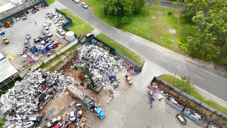 scrapyard operations with machinery and vehicles