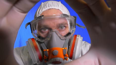 scientist virologist in respirator. man close up look, wearing protective medical mask. concept health safety n1h1 coronavirus epidemic 2019 ncov.