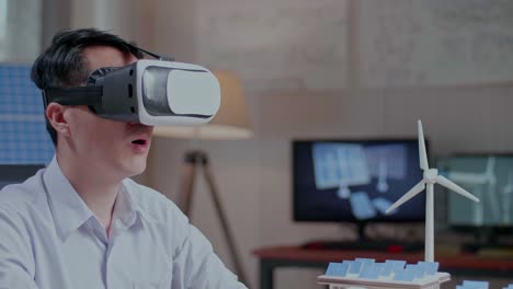 man experiencing virtual reality in a modern office environment focused on alternative energy