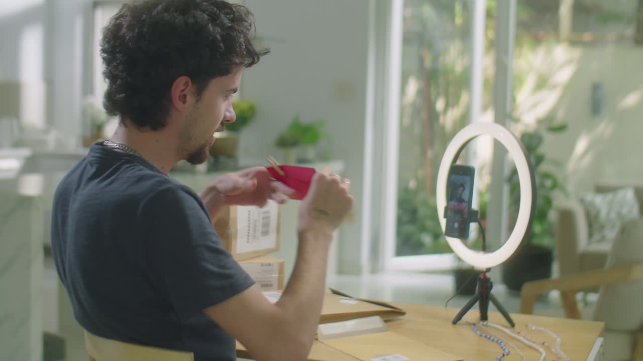 Male Vlogger Filming Review of Orders