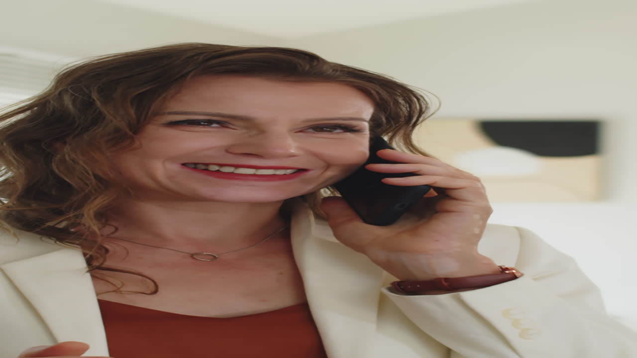 Female Entrepreneur Calling Client on Smartphone