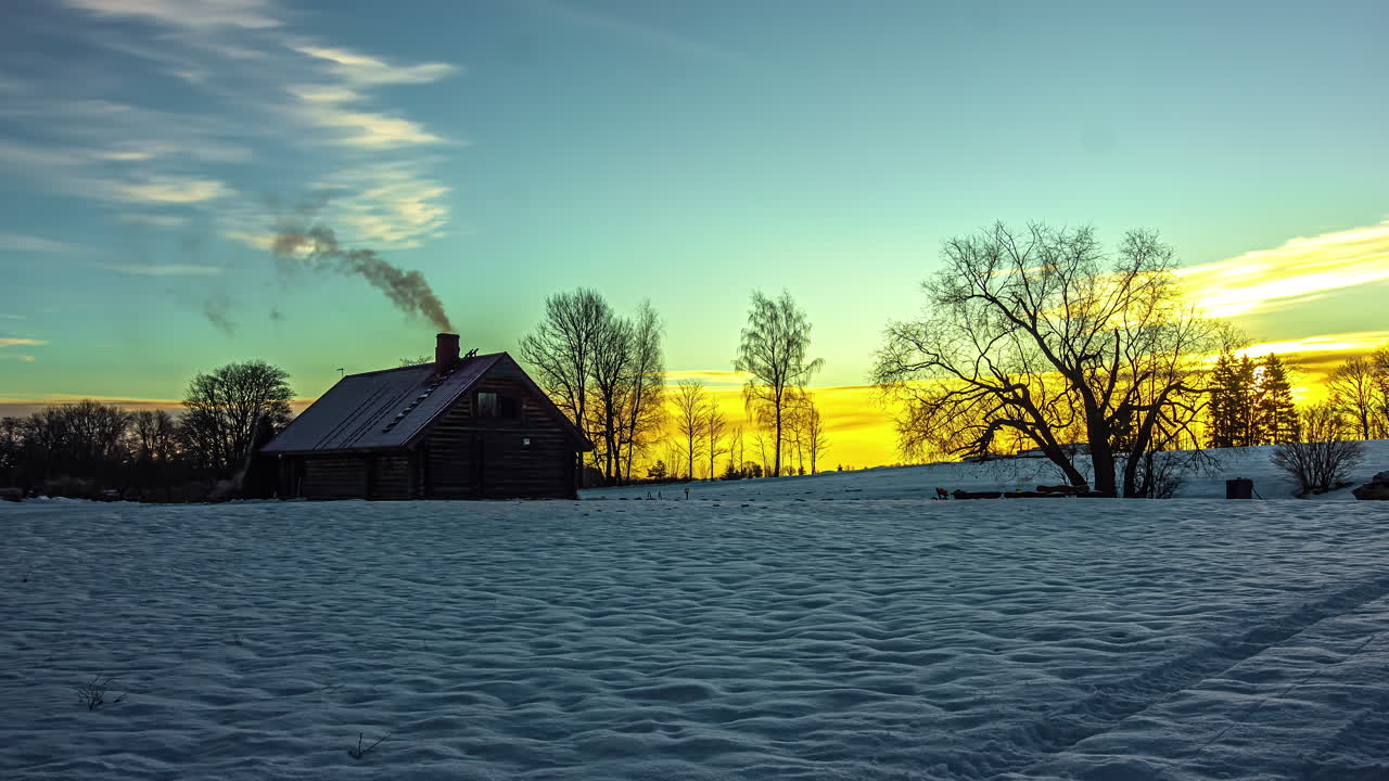Timelapse of Winter's Morning Sunrise over a Winter Lodge House Landscape in Latvia