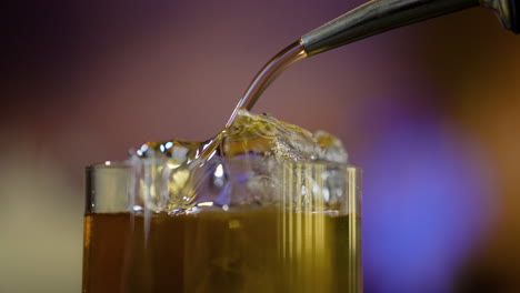 bartender serving whisky