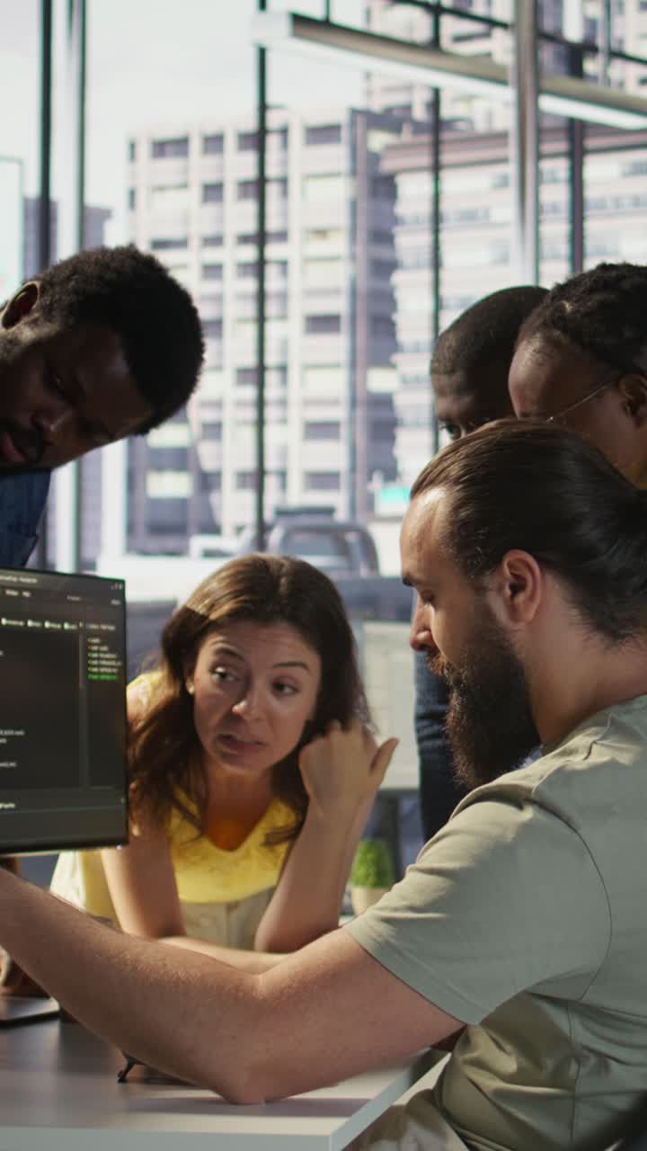 Vertical video Team of software engineers doing brainstorming in office