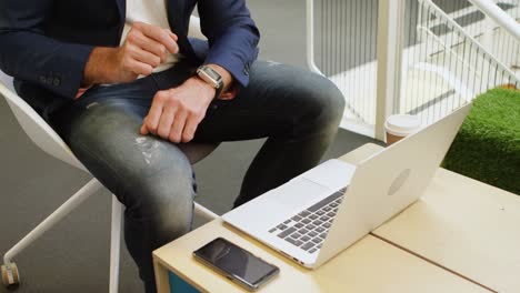 Businessman-using-smartwatch-in-office-4k